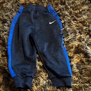 Nike Kids Black Joggers with Blue Stripes